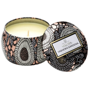 A coconut wax candle in a decorative japanese inspired tin voluspa