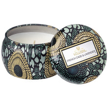 A coconut wax candle in a decorative japanese inspired tin lavender voluspa