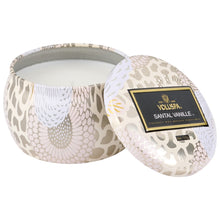 A coconut wax candle in a decorative japanese inspired tin santal vanille voluspa
